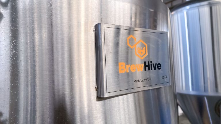 image of BrewHive Logo on wall